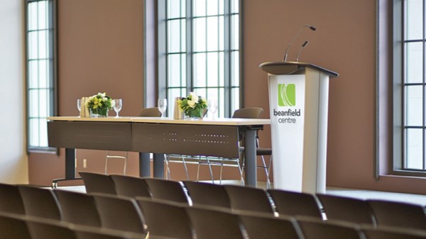 a lectern with branding at an event centre.