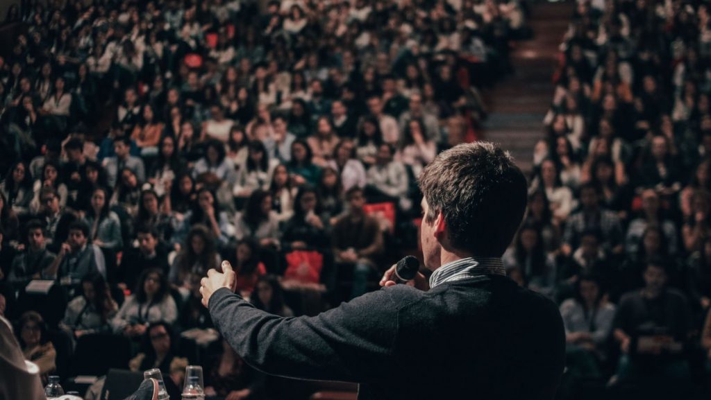 Public speaker in front of crowd