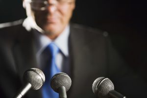 Man with microphones doing presentation