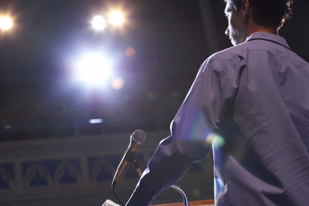 speaking-behind-a-lectern