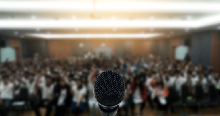 Microphone in front of crowd to public speak