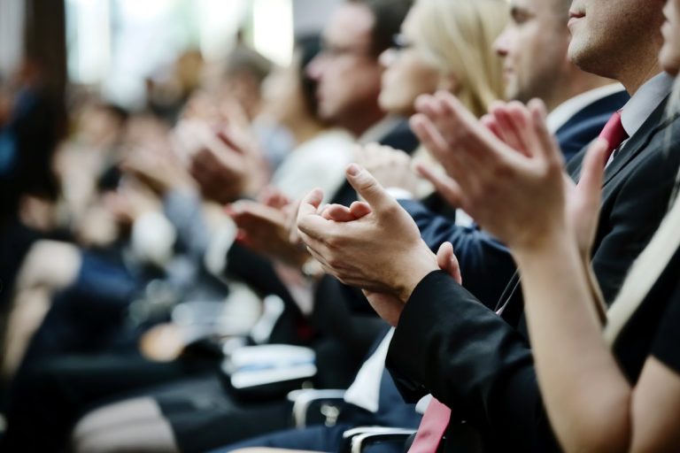 audience at event applauding