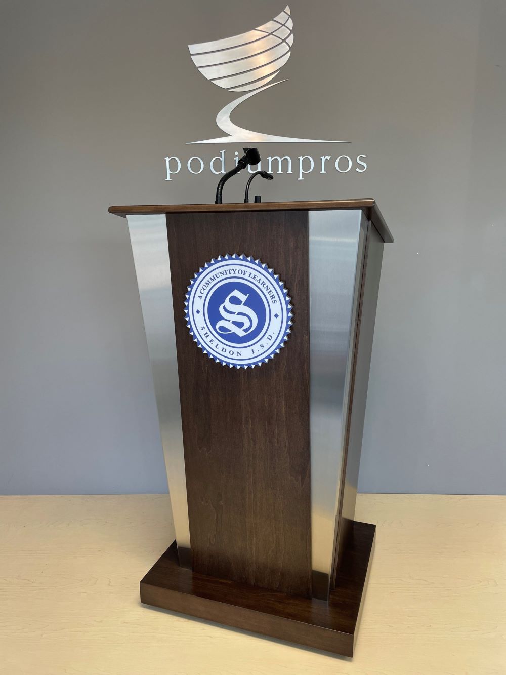 Podium Pros' wood empire lectern with branding