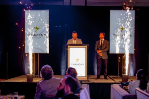 Two men standing at a podium