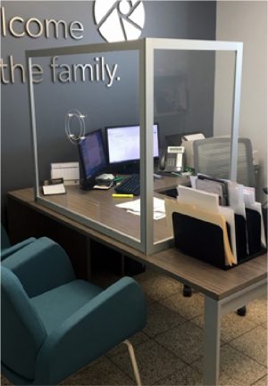 An acrylic barrier on a desk