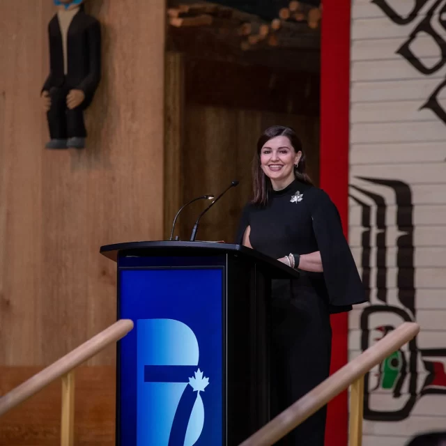 Candace Laing speaking behind the H2W Digital Display Podium at the Canadian Chamber of Commerce B7 Summit